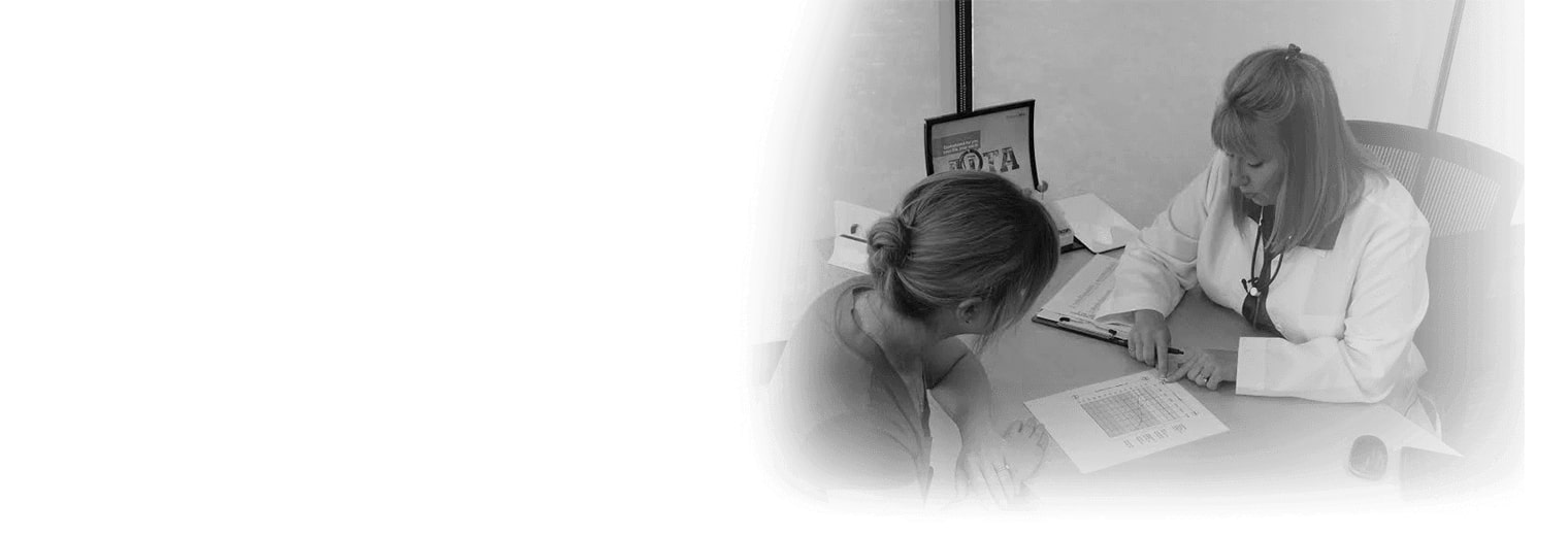 Audiologist providing patient hearing test results