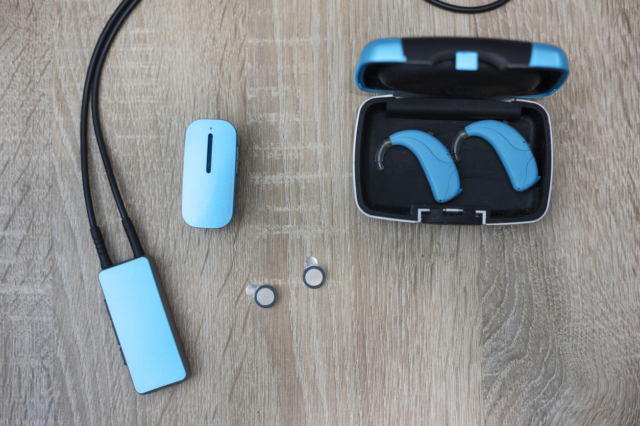 Modern hearing aid accessories blue