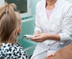 A child receives a hearing test.