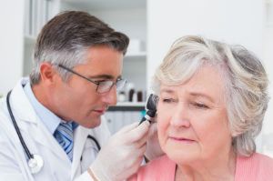 A woman gets a hearing exam.